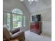 Sitting room with large windows, a leather chair, and carpet flooring at 405 Widdington Ln, Cary, NC 27519