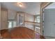 Upstairs hallway with hardwood floors, white doors, and a view of the foyer through the staircase at 405 Widdington Ln, Cary, NC 27519
