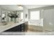 Bright bathroom features dual sinks, a soaking tub, and a glass-enclosed shower at 409 Falls Bluff Dr, Wake Forest, NC 27596
