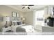 Cozy bedroom with neutral color scheme, natural lighting, and carpet at 409 Falls Bluff Dr, Wake Forest, NC 27596