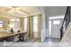 Dining room with coffered ceiling, modern chandelier, and large windows with patterned curtains at 409 Falls Bluff Dr, Wake Forest, NC 27596