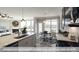 Bright kitchen with large island, stainless steel appliances, and adjacent breakfast nook at 409 Falls Bluff Dr, Wake Forest, NC 27596