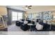 Spacious living room with ceiling fan, neutral decor, and multiple seating areas at 409 Falls Bluff Dr, Wake Forest, NC 27596