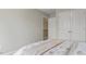 Bright bedroom showcases neutral walls, plush carpet, and access to the upper level, creating a peaceful retreat at 413 Falls Bluff Dr, Wake Forest, NC 27587