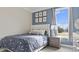 Comfortable bedroom with natural light, a cozy bed, and stylish furnishings at 413 Falls Bluff Dr, Wake Forest, NC 27587
