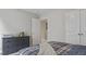 Well-lit bedroom featuring neutral walls, a dresser, and a comfortable bed at 413 Falls Bluff Dr, Wake Forest, NC 27587