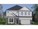 Charming two-story home with stone accents and a two-car garage at 413 Falls Bluff Dr, Wake Forest, NC 27587