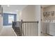 Upstairs hallway with stairs, laundry area with washer and dryer at 413 Falls Bluff Dr, Wake Forest, NC 27587