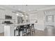 Bright, modern kitchen with island seating and stainless steel appliances at 413 Falls Bluff Dr, Wake Forest, NC 27587