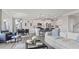Open-concept living space with a modern kitchen, dining area, and comfortable living room at 413 Falls Bluff Dr, Wake Forest, NC 27587