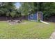Spacious backyard features a shed, fire pit, and lush green grass at 418 Ridgefield Rd, Chapel Hill, NC 27517