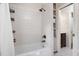 Bathroom with a subway-tiled shower and wall-mounted organizers at 418 Ridgefield Rd, Chapel Hill, NC 27517