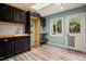 Mud room with built-in storage, sink, and access to the backyard at 418 Ridgefield Rd, Chapel Hill, NC 27517