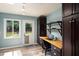 Office area with built-in desk, cabinets, and a view of the backyard at 418 Ridgefield Rd, Chapel Hill, NC 27517