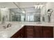 Bathroom with double sinks, granite countertops, and a large mirror reflecting the shower at 4221 Bibleway Ct, Holly Springs, NC 27540