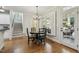 Cozy dining area with hardwood floors, a chandelier, and access to an outdoor patio at 4221 Bibleway Ct, Holly Springs, NC 27540
