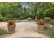 Beautiful backyard swimming pool featuring a rock waterfall and lush landscaping offering a private outdoor retreat at 4221 Bibleway Ct, Holly Springs, NC 27540