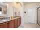 Bathroom featuring double sinks with a granite countertop and ample storage space at 425 Cottonseed Way, Durham, NC 27703