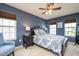 Comfortable bedroom with a ceiling fan, natural light, and a relaxing atmosphere at 425 Cottonseed Way, Durham, NC 27703