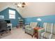 Cozy bedroom with a pitched ceiling, ceiling fan, and accent furniture at 425 Cottonseed Way, Durham, NC 27703