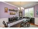 Formal dining room with elegant lighting, wine rack, and space for entertaining at 425 Cottonseed Way, Durham, NC 27703