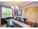 Well-lit dining room with elegant light fixture and hardwood floors at 425 Cottonseed Way, Durham, NC 27703