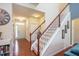 Bright foyer with hardwood floors and a staircase leading to the second floor at 425 Cottonseed Way, Durham, NC 27703