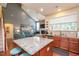 Open-concept kitchen with granite countertops and a kitchen island at 425 Cottonseed Way, Durham, NC 27703
