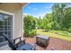 Cozy patio area with comfortable seating and views of the beautifully landscaped backyard at 425 Cottonseed Way, Durham, NC 27703
