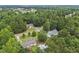 This aerial view showcases homes with lush greenery and serene neighborhood streetscapes at 436 Madison Ave, Princeton, NC 27569