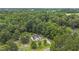 Aerial view of a cozy home nestled in a lush, green forest, providing privacy and a tranquil setting at 436 Madison Ave, Princeton, NC 27569