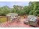 Spacious back deck with outdoor furniture and wooded views, perfect for entertaining at 436 Madison Ave, Princeton, NC 27569