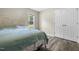 Bedroom with wood-look flooring, a window, a bed, and a closet at 436 Madison Ave, Princeton, NC 27569