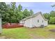 Exterior view of the house showing backyard deck and well-maintained lawn at 436 Madison Ave, Princeton, NC 27569