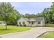 Well-maintained home featuring a long driveway and lush green lawn at 436 Madison Ave, Princeton, NC 27569