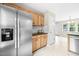Modern kitchen featuring stainless steel appliances, ample counter space, and bright lighting at 436 Madison Ave, Princeton, NC 27569