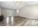 Spacious living room with sleek floors, vaulted ceilings, and lots of natural light at 436 Madison Ave, Princeton, NC 27569