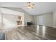 Living room with hard surface floors opening to a dining and kitchen space at 436 Madison Ave, Princeton, NC 27569
