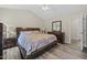 Well-lit main bedroom with vaulted ceiling, hardwood floors, and comfortable furnishings at 436 Madison Ave, Princeton, NC 27569