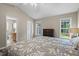 Cozy main bedroom with vaulted ceilings, offering generous natural light and en-suite bathroom at 436 Madison Ave, Princeton, NC 27569