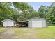This property features multiple outbuildings, including a shop and shed, great for storage and hobbies at 436 Madison Ave, Princeton, NC 27569