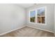 Cozy bedroom with neutral carpet and nice natural light from the double window at 440 Heritage Village Ln, Apex, NC 27502