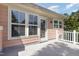 Exterior view of a neutral colored home with a patio and access door at 440 Heritage Village Ln, Apex, NC 27502