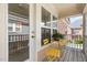 Cozy covered porch featuring bright yellow furniture at 440 Heritage Village Ln, Apex, NC 27502