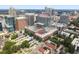 Aerial view of the city featuring a brick building in the center surrounded by green trees at 444 S Blount St # 209, Raleigh, NC 27601