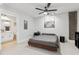 Cozy bedroom with modern ceiling fan, decor, and en-suite bathroom access at 444 S Blount St # 209, Raleigh, NC 27601