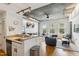 Bright living area featuring hardwood floors, concrete ceilings, and lots of natural light at 444 S Blount St # 209, Raleigh, NC 27601