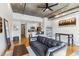 Open-concept living area with modern furnishings, concrete ceiling, and hardwood floors at 444 S Blount St # 209, Raleigh, NC 27601