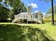 Enjoy the expansive backyard with a spacious deck perfect for outdoor gatherings at 5 Sue Ann Ct, Durham, NC 27704