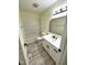 Modern bathroom features stylish vanity, mirror, and well-maintained shower tub with a seamless design at 5 Sue Ann Ct, Durham, NC 27704